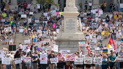 Demonstrators participate in a Hands Off protest at the statehouse on April 5, 2025 in Columbia, South Carolina. Protests against Trump administration policies and Elon Musk's Department of Government Efficiency (DOGE) are being held nationwide. (Getty Images via AFP)
