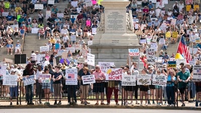Demonstrators participate in a Hands Off protest at the statehouse on April 5, 2025 in Columbia, South Carolina. Protests against Trump administration policies and Elon Musk's Department of Government Efficiency (DOGE) are being held nationwide in what organizers are calling a National Day of Action.  (Getty Images via AFP)