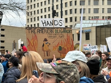 A protest sign at a Hands Off! demonstration (X/@kyranight5) A protest sign at a Hands Off! demonstration (X/@kyranight5)