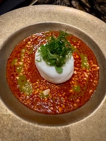 Burrata in a curry sauce at revolver. Burrata in a curry sauce at revolver.