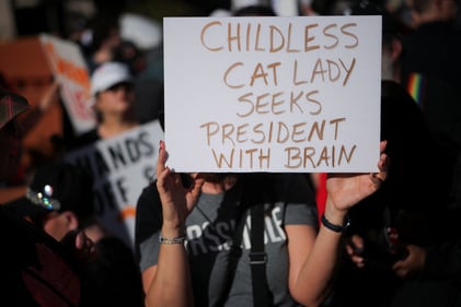 A demonstartor holds a sign while taking part in a 'Hands Off!' protest against U.S. President Donald Trump and his adviser Elon Musk, in Los Angeles, California, U.S., April 5, 2025. REUTERS/Daniel Cole (REUTERS)
