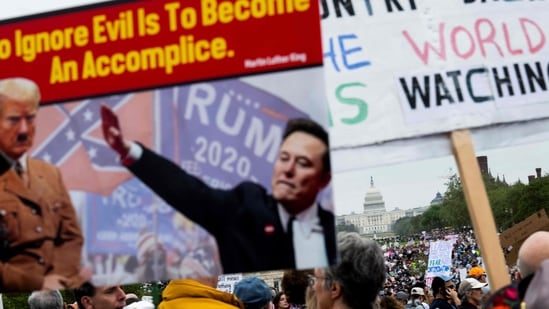  Protesters gather on the National Mall for the nationwide "Hands Off!" protest against US President Donald Trump and his advisor, Tesla CEO Elon Musk, in Washington, DC, on April 5, 2025. Thousands of people descended on Washington's National Mall and other cities across the United States in opposition to the policies of Donald Trump, in the largest protests since he returned to the presidency.(AFP)