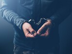 Arrested computer hacker and cyber criminal with handcuffs, close up of hands. (iStockphoto) Arrested computer hacker and cyber criminal with handcuffs, close up of hands. (iStockphoto)