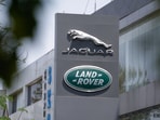 Jaguar and Land Rover, the British vehicle-brand logos of Indian-owned Tata Motors, are displayed in front of their showroom in New Delhi, India.
