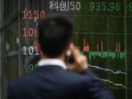 As investors prepared for the consequences of an escalating trade war between the two biggest economies in the world, Chinese stocks and corporate bonds fell sharply, and sovereign yields approached an all-time low.