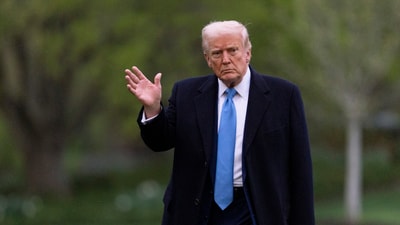 US President Donald Trump waves as he walks on the South Lawn upon arrival at the White House on April 6, 2025, in Washington. (AP)
