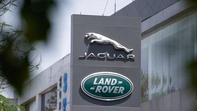 Jaguar and Land Rover, the British vehicle-brand logos of Indian-owned Tata Motors, are displayed in front of their showroom in New Delhi, India. (REUTERS)