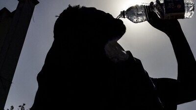 The Met declares a heatwave when the maximum temperature is at least 40 degrees Celsius (°C), and is also 4.5°C or more above normal. Alternatively, any day when the maximum crosses 45°C or higher also qualifies as a heatwave. A “severe heatwave” is one where the maximum is 6.5°C above normal. (File Photo by Shammi MEHRA / AFP) (AFP) The Met declares a heatwave when the maximum temperature is at least 40 degrees Celsius (°C), and is also 4.5°C or more above normal. Alternatively, any day when the maximum crosses 45°C or higher also qualifies as a heatwave. A “severe heatwave” is one where the maximum is 6.5°C above normal. (File Photo by Shammi MEHRA / AFP) (AFP)