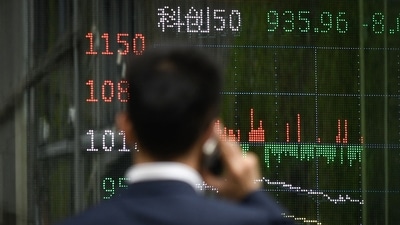 As investors prepared for the consequences of an escalating trade war between the two biggest economies in the world, Chinese stocks and corporate bonds fell sharply, and sovereign yields approached an all-time low. (AFP)