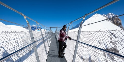Take a walk filled with fun and peaks below, at the Titlis Cliff Walk Take a walk filled with fun and peaks below, at the Titlis Cliff Walk