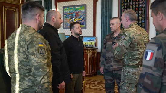 Ukrainian President Volodymyr Zelensky (3-L), Minister of Defence of Ukraine Rustem Umierov (2-L), meet with French Chief of the Defence Staff General Thierry Burkhard (3-R) and British Chief of the Defence Staff Admiral Tony Radakin (2-R) in Kyiv, amid the Russian invasion of Ukraine. (AFP/ Ukraine Presidential Press)