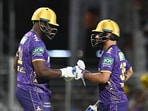 Kolkata Knight Riders' Andre Russell interacts with Rinku Singh