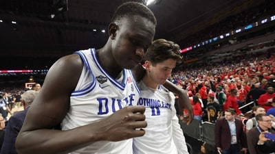 Khaman Maluach #9 of the Duke Blue Devils reacts with teammate after the second half in the Final Four game of the NCAA Men's Basketball Tournament against the Houston Cougars at the Alamodome on April 05, 2025 in San Antonio, Texas. (Photo by JAMIE SQUIRE / GETTY IMAGES NORTH AMERICA / Getty Images via AFP) (Getty Images via AFP) Khaman Maluach #9 of the Duke Blue Devils reacts with teammate after the second half in the Final Four game of the NCAA Men's Basketball Tournament against the Houston Cougars at the Alamodome on April 05, 2025 in San Antonio, Texas. (Photo by JAMIE SQUIRE / GETTY IMAGES NORTH AMERICA / Getty Images via AFP) (Getty Images via AFP)