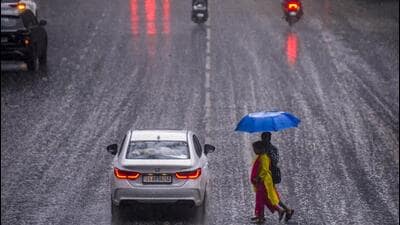 Citizens commute amid heavy rain in Pune. (PTI Photo) Citizens commute amid heavy rain in Pune. (PTI Photo)