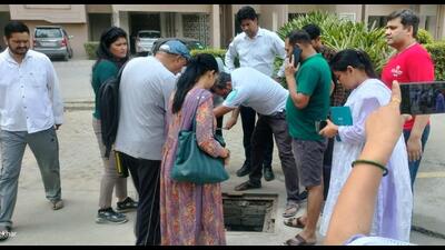 Following the surge in complaints, officials from the Greater Noida authority and the district health department visited the society on Tuesday and collected water samples. (HT Photo) Following the surge in complaints, officials from the Greater Noida authority and the district health department visited the society on Tuesday and collected water samples. (HT Photo)