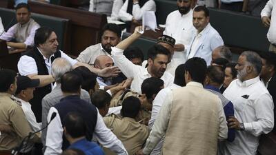 Jammu and Kashmir MLAs raising slogans and arguing with each other during the budget session of the assembly in Jammu on Tuesday. (PTI Photo)