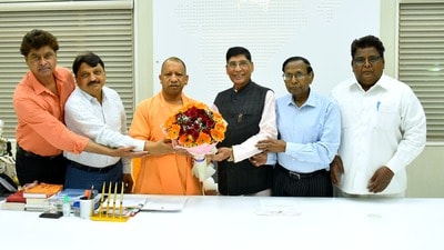 MLA from Agra GS Dharmesh and organising committee member of Bhim Nagari organising central committee meeting CM Aditya Nath at Lucknow on Monday. (HT) MLA from Agra GS Dharmesh and organising committee member of Bhim Nagari organising central committee meeting CM Aditya Nath at Lucknow on Monday. (HT)