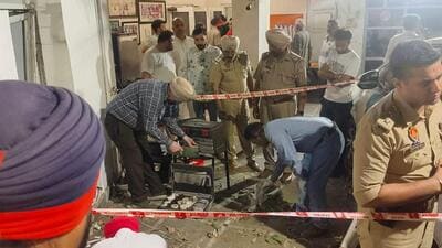Police and forensic experts collecting evidence after the blast at the house of Manoranjan Kalia’s house in Jalandhar on Tuesday. (HT Photo)