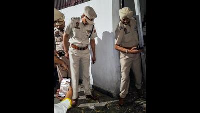 Police collecting evidence after a grenade blast outside the house of former Punjab minister and BJP leader Manoranjan Kalia in Jalandhar on Tuesday. (ANI Photo) Police collecting evidence after a grenade blast outside the house of former Punjab minister and BJP leader Manoranjan Kalia in Jalandhar on Tuesday. (ANI Photo)