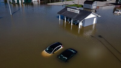 Vehicles are seen within the floodwaters from the Kentucky River on Monday, April 7, 2025, in Frankfort, Ky. (AP Photo/Jon Cherry) (AP) Vehicles are seen within the floodwaters from the Kentucky River on Monday, April 7, 2025, in Frankfort, Ky. (AP Photo/Jon Cherry) (AP)