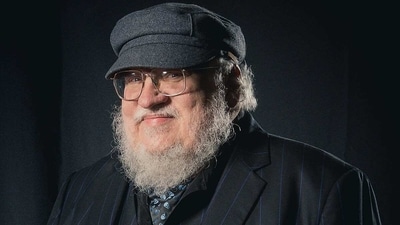 George R R Martin met the de-extinct dire wolves created by Colossal Biosciences (File) George R R Martin met the de-extinct dire wolves created by Colossal Biosciences (File)