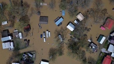 In areas of US midwest and south already flooded and severely devastated by days of intense rain and storms that claimed at least 23 lives, flooding grew worse over Monday, April 7. In pic: Camp Turn-A-Bout is flooded by the rising Ohio River at the Gunpowder Creek, Monday, April 7, 2025, in Union, Ky. (AP) In areas of US midwest and south already flooded and severely devastated by days of intense rain and storms that claimed at least 23 lives, flooding grew worse over Monday, April 7. In pic: Camp Turn-A-Bout is flooded by the rising Ohio River at the Gunpowder Creek, Monday, April 7, 2025, in Union, Ky. (AP)