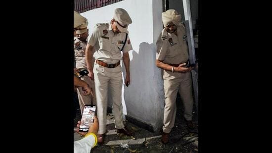 Police collecting evidence after a grenade blast outside the house of former Punjab minister and BJP leader Manoranjan Kalia in Jalandhar on Tuesday. (ANI Photo)