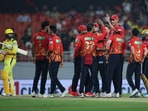 Punjab Kings players celebrate after the wicket of Chennai Super Kings' Rachin Ravindra 