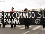 Demonstrators helda banner reading 'Southern Command out of Panama' during a protest against Hegseth, during his visit to Panama, in Panama City, Panama April 8, 2025. REUTERS/Maria Fernanda Gonzalez