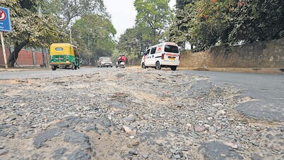 A damaged road in Maurice Nagar, near Delhi University. (HT ARCHIVE) A damaged road in Maurice Nagar, near Delhi University. (HT ARCHIVE)