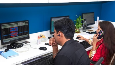 Brokers of a Rajasthan-based financial services provider react as they watch the stock prices on a digital screen, in Bikaner on Monday. (Representative pic ) Brokers of a Rajasthan-based financial services provider react as they watch the stock prices on a digital screen, in Bikaner on Monday. (Representative pic )