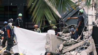 Rescue workers use sheets as they recover bodies from the rubble at the Jet Set nightclub after its roof collapsed two nights prior during a merengue concert in Santo Domingo, Dominican Republic, Wednesday, April 9, 2025. (AP Photo/Ricardo Hernandez) (AP) Rescue workers use sheets as they recover bodies from the rubble at the Jet Set nightclub after its roof collapsed two nights prior during a merengue concert in Santo Domingo, Dominican Republic, Wednesday, April 9, 2025. (AP Photo/Ricardo Hernandez) (AP)