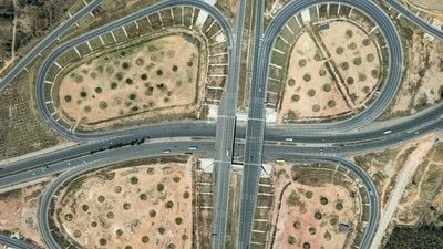 An aerial view shows partially opened stretch of Bengaluru-Chennai Expressway in Hoskote. (AFP) An aerial view shows partially opened stretch of Bengaluru-Chennai Expressway in Hoskote. (AFP)