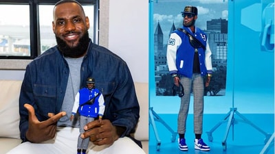 The LeBron doll wears sunglasses, headphones and an unzipped blue-and-white letterman's jacket with “LJ” on the left breast, his number 23 on the right sleeve and Ohio and crown patches on the other. The LeBron doll wears sunglasses, headphones and an unzipped blue-and-white letterman's jacket with “LJ” on the left breast, his number 23 on the right sleeve and Ohio and crown patches on the other.