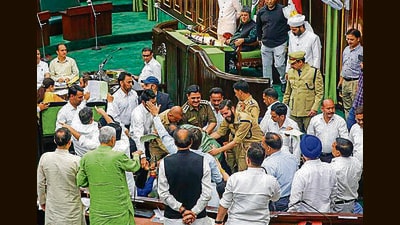 Legislators locked in scuffle inside the House during the budget session in Jammu on Wednesday. (PTI) Legislators locked in scuffle inside the House during the budget session in Jammu on Wednesday. (PTI)