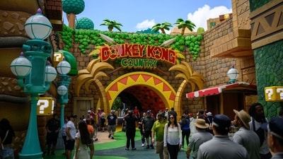 Guests walk past the entrance to Donkey Kong Country in the Super Nintendo World area, at the Epic Universe theme park in Orlando, Florida, US, on Saturday, April 5, 2025. Photographer: Thomas Simonetti/Bloomberg (Bloomberg)