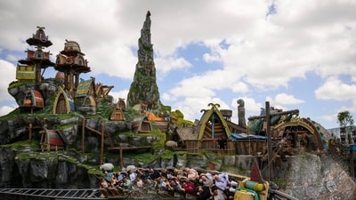 Guests ride the Hiccup's Wing Gliders rollercoaster in the How to Train Your Dragon - Isle of Berk area, at the Epic Universe theme park in Orlando, Florida, US, on Saturday, April 5, 2025. Photographer: Thomas Simonetti/Bloomberg (Bloomberg)