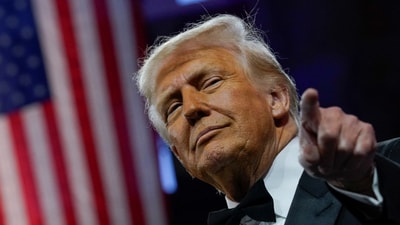 US President Donald Trump gestures as he attends the National Republican Congressional Committee (NRCC) dinner at the National Building Museum in Washington, DC. (REUTERS)