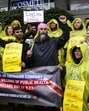 Canada NDP leader Jagmeet Singh poses for a photo with striking LifeLabs workers, BC General Employees' Union members and NDP candidate Sukhi Singh Sahota, centre left, on the picket line during a campaign stop in Vancouver, British Columbia, Canada, on April 8. (AP)