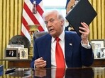 President Donald Trump holds an executive order in the Oval Office of the White House. AP/PTI(AP04_10_2025_000017B)(AP)