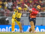 MS Dhoni (L) looks on as Priyansh Arya deposits one into the stands MS Dhoni (L) looks on as Priyansh Arya deposits one into the stands