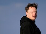 FILE PHOTO: Tesla CEO Elon Musk walks to board Air Force One with U.S. President Donald Trump (not pictured) as they depart for Philadelphia, Pennsylvania, from Morristown Municipal Airport in Morristown, New Jersey, U.S., March 22, 2025. REUTERS/Nathan Howard/File Photo