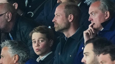 Britain's Prince George, with his father Prince William, attends the Champions League quarterfinal first leg soccer match between Paris Saint-Germain and Aston Villa at Parc des Princes stadium in Paris, Wednesday, April 9, 2025. (AP Photo/Aurelien Morissard) (AP)