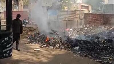 Garbage burning near the bus stand. (HT Photo) Garbage burning near the bus stand. (HT Photo)