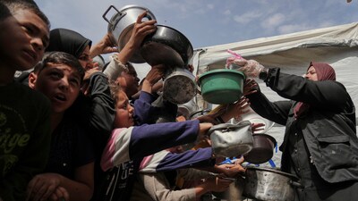 Palestinians wait to get donated food at a distribution center in Beit Lahiya in the northern Gaza Strip, Monday, April 7, 2025. (AP) Palestinians wait to get donated food at a distribution center in Beit Lahiya in the northern Gaza Strip, Monday, April 7, 2025. (AP)