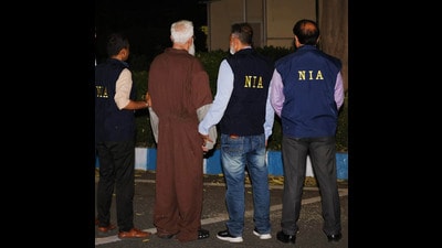 Mumbai terror attacks plotter Tahawwur Rana with NIA officials in New Delhi. (PTI PHOTO)