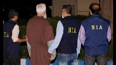 NIA officials with Tahawwur Hussain Rana in New Delhi on Thursday. (ANI PHOTO) NIA officials with Tahawwur Hussain Rana in New Delhi on Thursday. (ANI PHOTO)