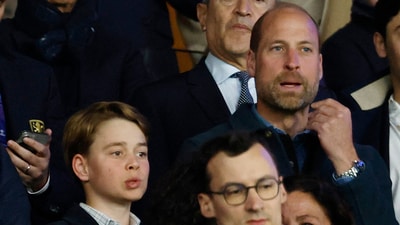 Soccer Football - Champions League - Quarter Final - First Leg - Paris St Germain v Aston Villa - Parc des Princes, Paris, France - April 9, 2025 Britain's Prince William and his son Prince George are seen in the stands before the match REUTERS/Stephanie Lecocq (REUTERS)
