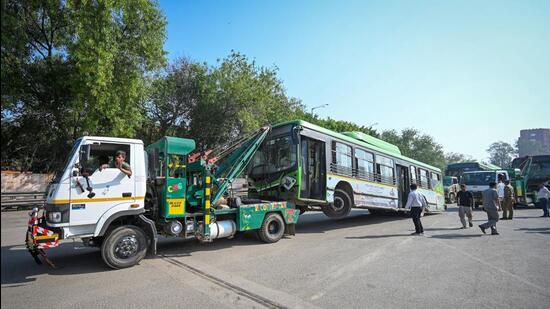 A scrapped or damaged DTC bus been taken out from a bus depot near Dayal Singh College on March 16, 2025. (Sanchit Khanna/HT PHOTO)
