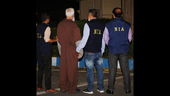 Mumbai terror attacks plotter Tahawwur Rana with NIA officials in New Delhi. (PTI PHOTO)